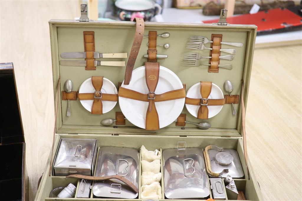 A 1930s picnic set, in a canvas covered case (incomplete)